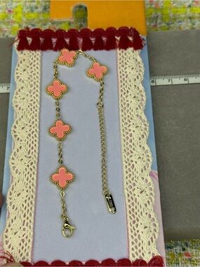 Gold-Tone Bracelet with Pink Clover Charms
